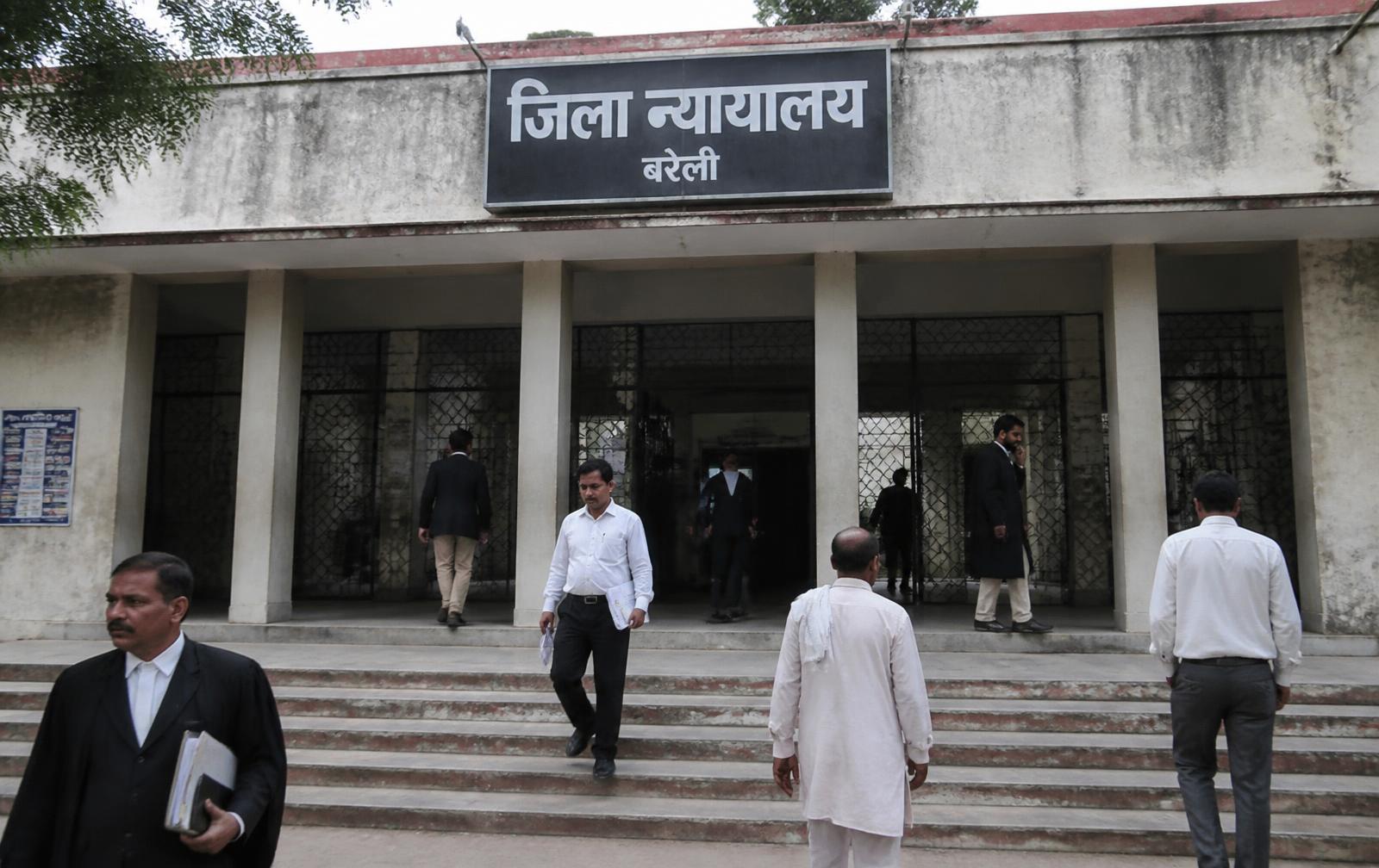 District court building entrance in Uttar Pradesh with advocates on the steps
